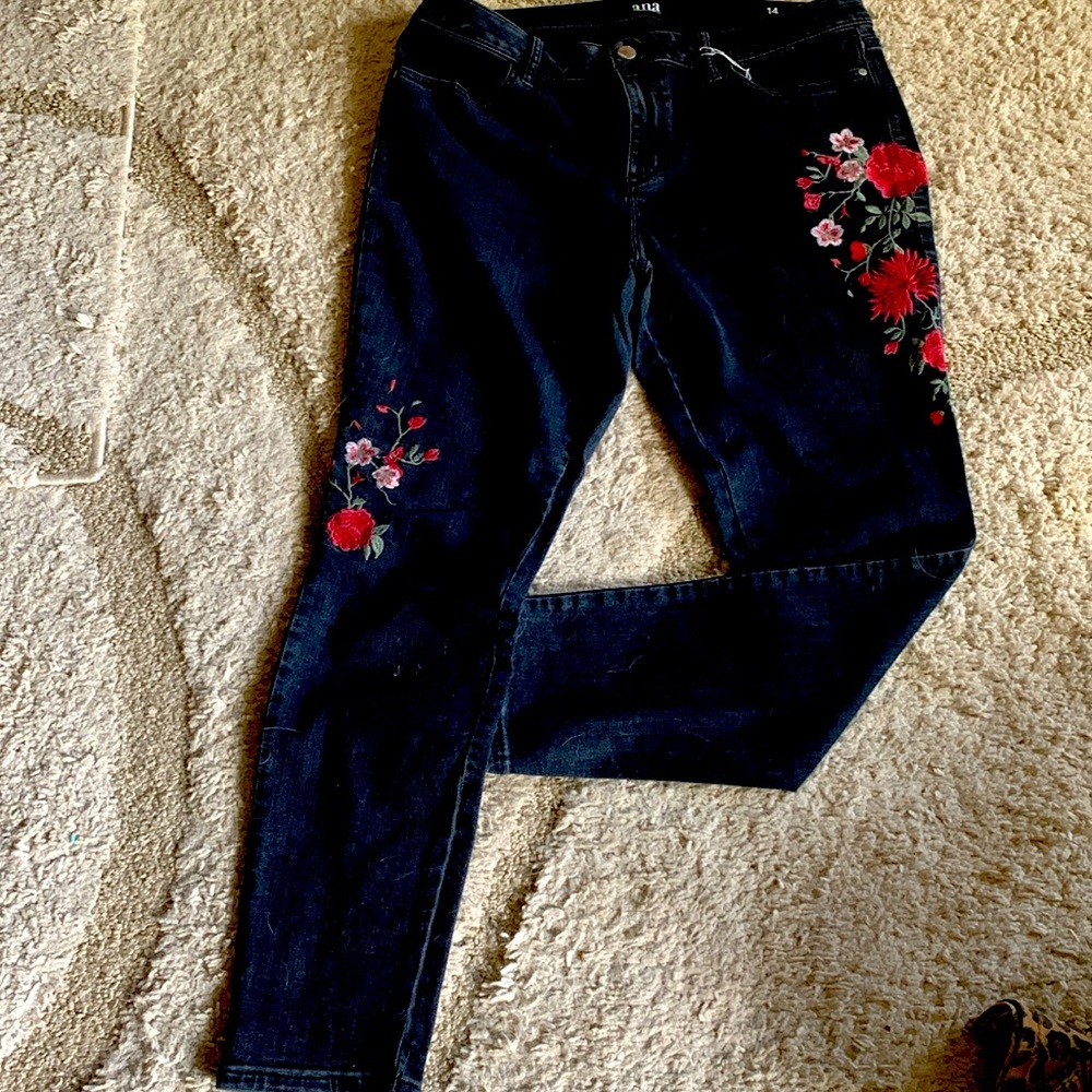 A beautiful pair on blue jeans either two floral designs straight skinny legs